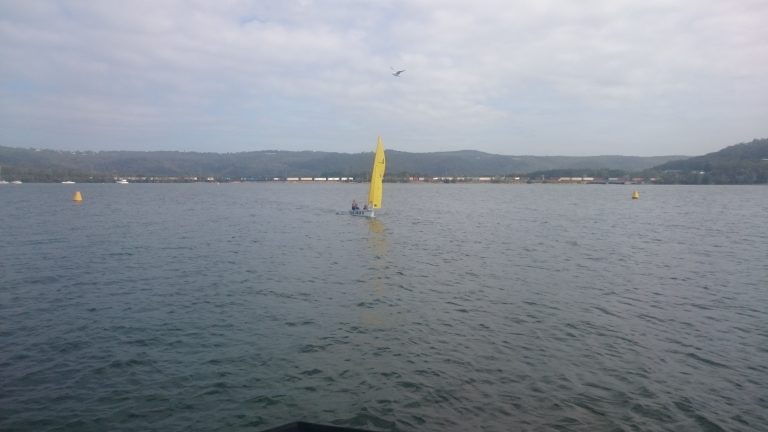 Sailboat sailing back to dock further away