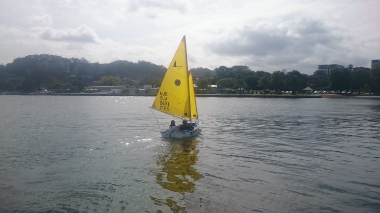 Sailboat leaving dock