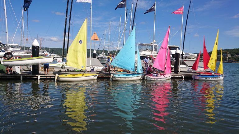 Sailboats getting ready to launch